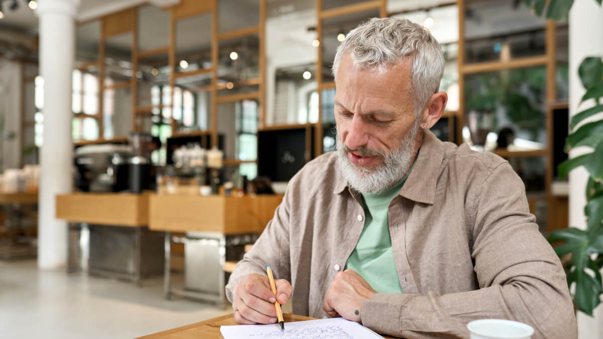 Older man journaling